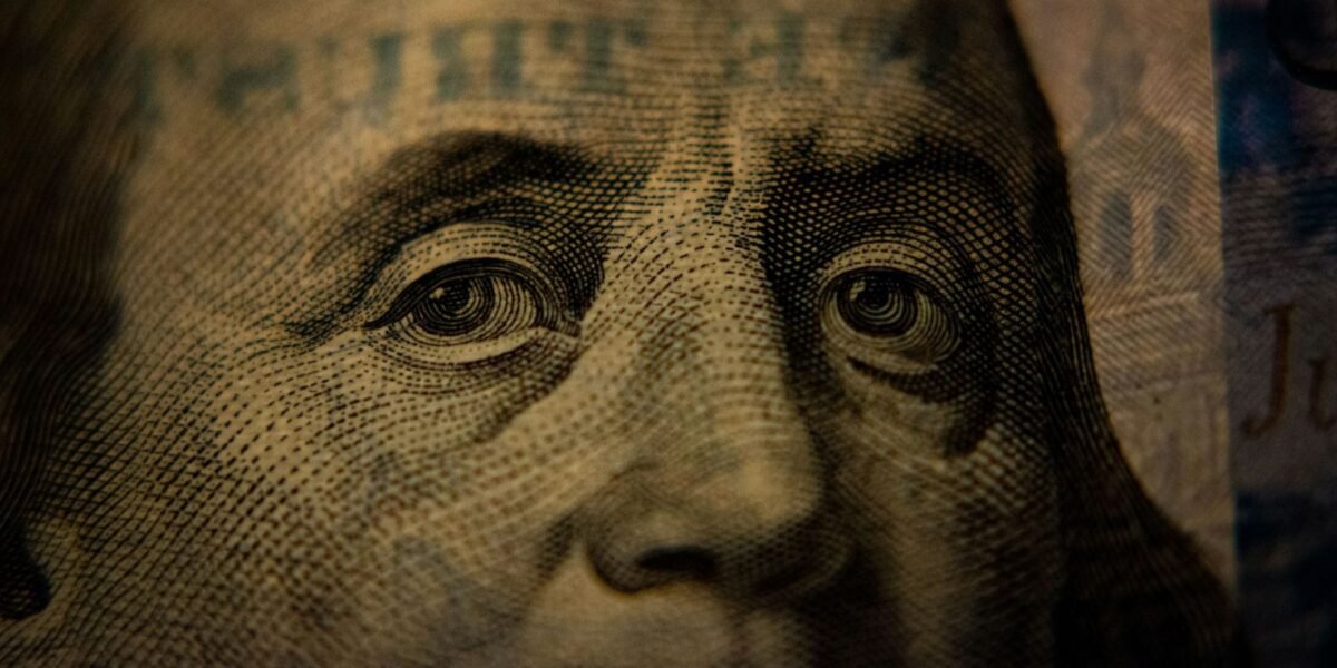 Close-up look of Benjamin Franklin in 100 USD bill front face